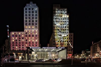 Illuminated buildings in city at night