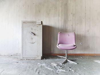 Empty chair in abandoned building