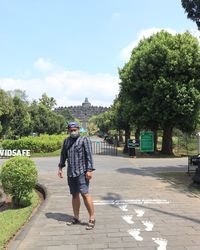Standing in front of borobudur temple