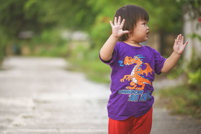 Full length of boy standing outdoors