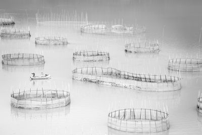 High angle view of fishing net on lake
