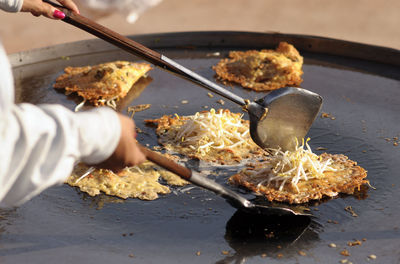 Close-up of person preparing food