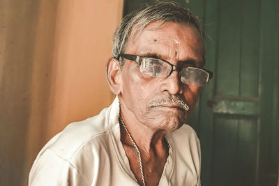 Portrait of man wearing eyeglasses