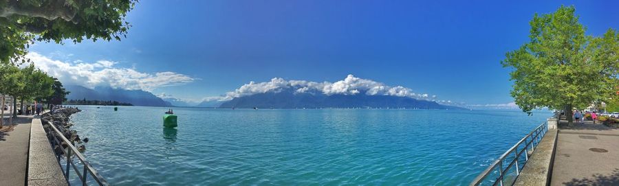 Scenic view of sea against blue sky