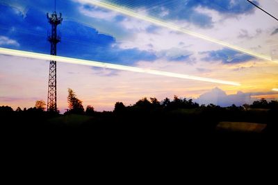 Silhouette of landscape against sky at sunset