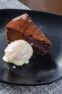 Close-up of ice cream with cake in plate