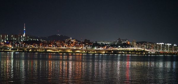 Illuminated buildings in city at night