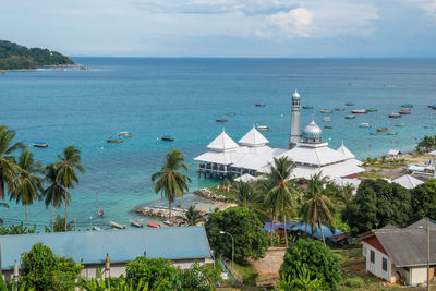 High angle view of swimming pool by sea against sky