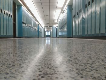 Empty corridor along pillars