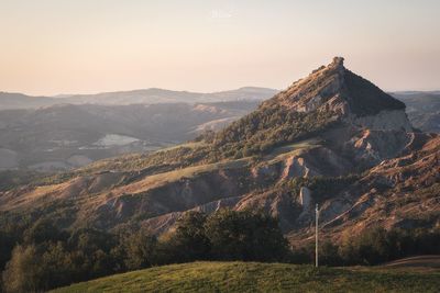 Scenic view of mountain range against sky during sunset