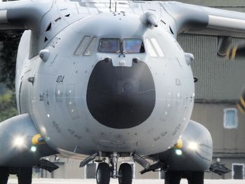 Close-up of airplane on airport runway