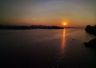 Scenic view of sea against sky at sunset