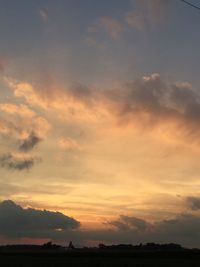 Scenic view of landscape against sky at sunset