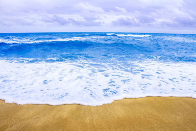 Scenic view of beach against sky