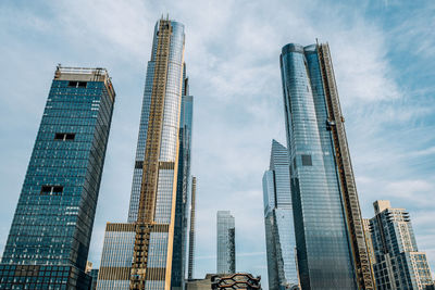 Low angle view of modern buildings against sky