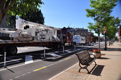 Vehicles on road against buildings