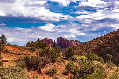 Scenic view of mountains against cloudy sky