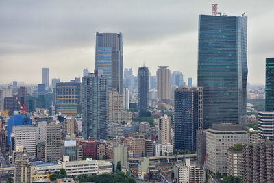 Modern buildings in city against sky