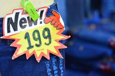 Close-up of price tag on jeans at clothing store