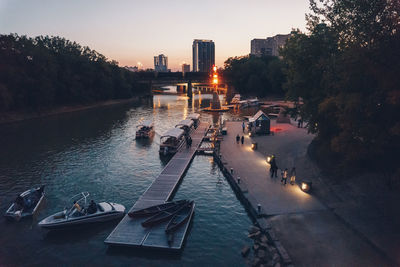 Panoramic view of people in city against clear sky