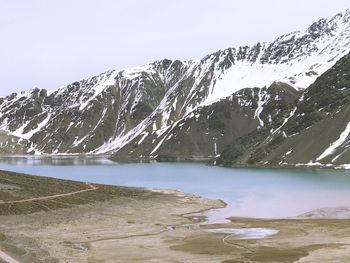 Scenic view of lake against clear sky during winter