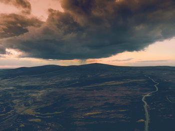 Scenic view of landscape against sky during sunset