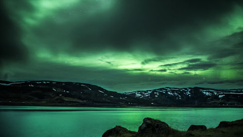 Scenic view of mountains against dramatic sky