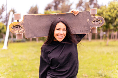 Rear view of woman standing in park