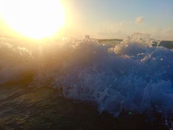 Aerial view of landscape against sky during sunset