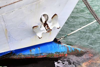 High angle view of rope tied to fishing boat