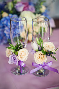 Wedding glasses on the table with decorations and flowers