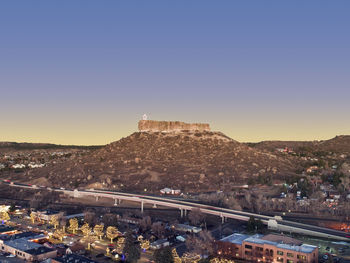 High angle view of buildings in city against clear sky