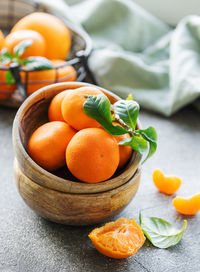 Fresh citrus fruits tangerines, oranges on a concrete background