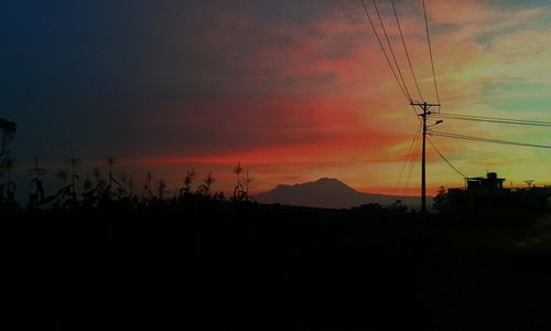 Silhouette of landscape against dramatic sky