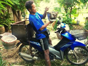 Side view of man riding bicycle