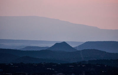 Scenic view of silhouette mountains against clear sky