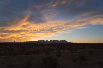 Scenic view of landscape against sky during sunset