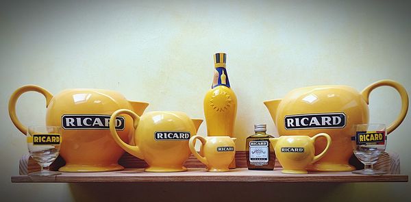 Close-up of yellow bottles on table