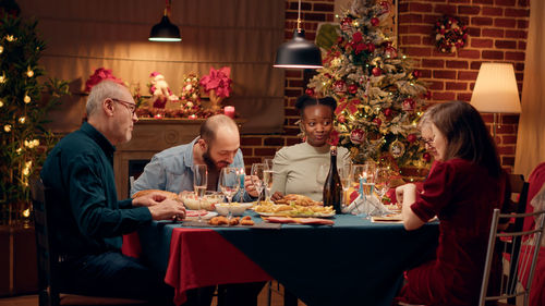 Friends sitting on table