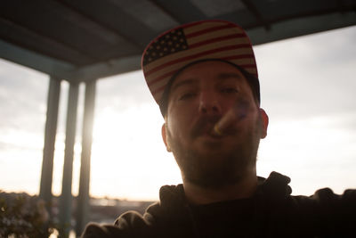 Low angle portrait of man against the sky