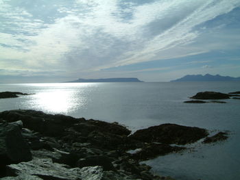 Scenic view of sea against cloudy sky