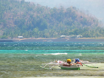 Scenic view of boat in sea