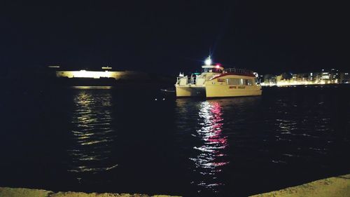 Reflection of illuminated buildings in water