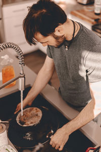 Midsection of man preparing food at home