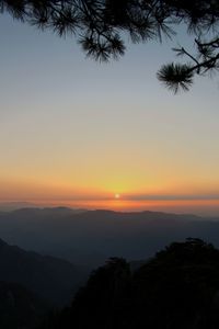 Scenic view of silhouette landscape against romantic sky at sunset