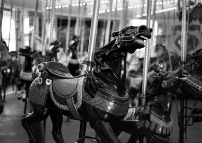 Side view of carousel in amusement park