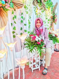 Portrait of woman holding bouquet