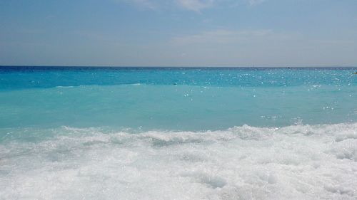 Scenic view of sea against blue sky