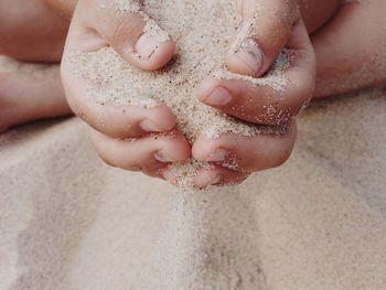 Cropped image of woman holding hands