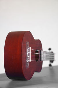 Close-up of guitar against white background